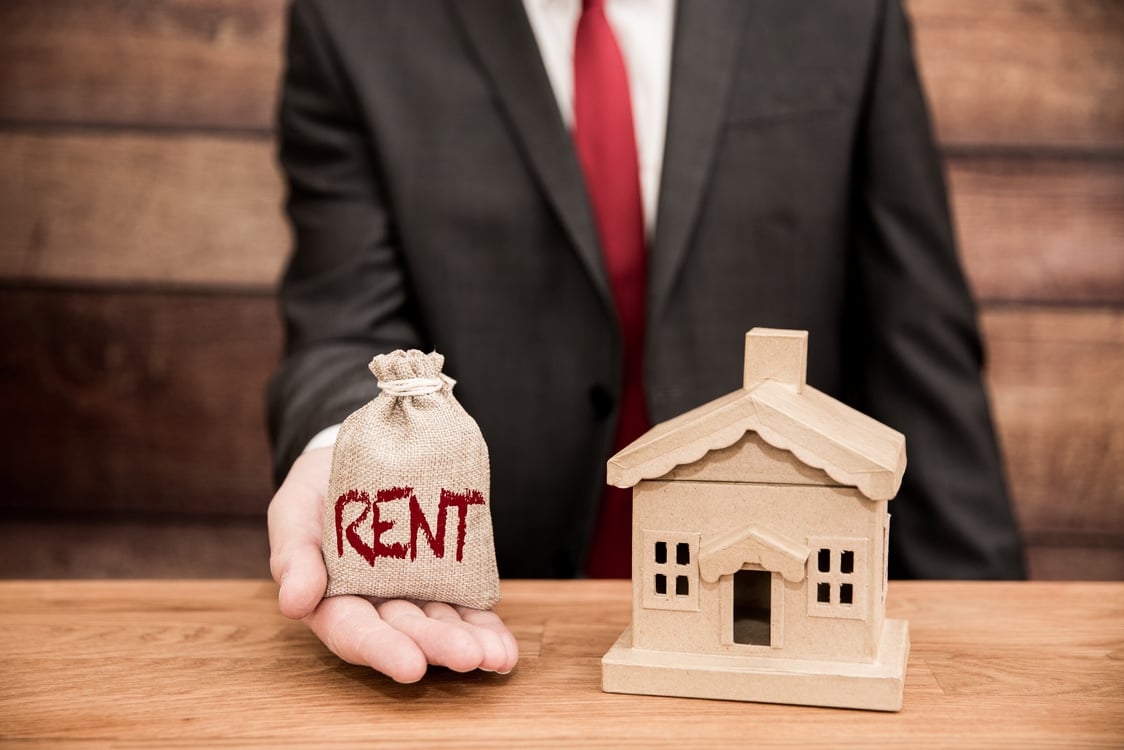 A renting or rent housing concept with a landlord demanding property rent